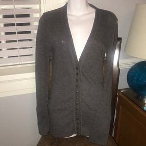 Cardigan with buttons that can be undone